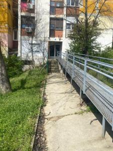 a bridge over a sidewalk in front of a building at Dona1102 in Žarkovo