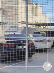 a view of parked cars in a parking lot at SAN TAURO VIEDMA in Viedma