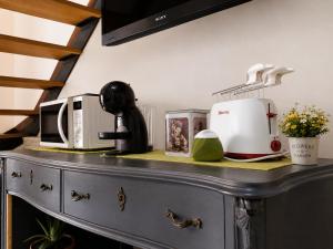 a kitchen counter with appliances on top of it at Lilly House Perfect stopover near Lake Como Switzerland and Milan in Fino Mornasco