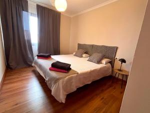 a bedroom with a bed with two pillows on it at Villa Casa Papaya - All Year Heated Pool in La Orotava +21 photos