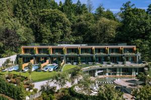 an aerial view of a building with a garden at Hotel Chalet Das Alpenschlössel in Saltusio