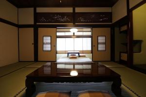 a room with a room with a bed and a window at Yanagawa B&B hatago in Yanagawa +4 photos