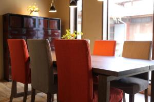 a dining room with a table and chairs at Yanagawa B&B hatago in Yanagawa