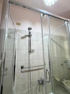 a glass shower in a bathroom with a sink at Mare e Monti a 5 minuti dal mare in Furnari +22 photos