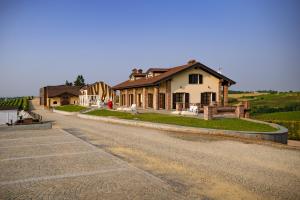 a house on the side of a road at Montalbera Wine Suites in Montemagno