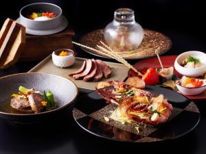 a table with plates of food on a table at hotel kanra kyoto in Kyoto