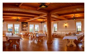 a large dining room with tables and chairs in it at Willa na Borku in Ciche