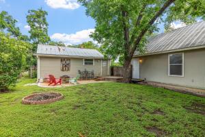 a house with a yard with a fire pit at Beverly Haus in Fredericksburg