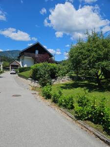 a house on the side of a road at Holiday Home NA VASI in Gorenja Vas