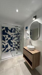 a bathroom with a shower and a sink and a mirror at Hotelito Boutique Madrid Auditorio in Madrid +109 photos