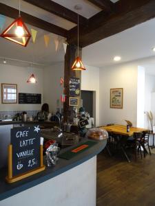 a restaurant with a counter with a cafe rift valley sign at Hostel20 Bayonne in Bayonne +34 photos