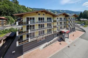 an aerial view of a hotel with mountains in the background at Leni-Marie Saalbach in Saalbach-Hinterglemm
