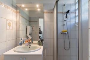 a bathroom with a sink and a shower at My Alba in Jaujac