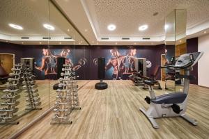 a gym with treadmills and exercise equipment at Leni-Marie Saalbach in Saalbach-Hinterglemm