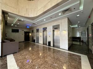 a lobby of a building with a waiting room at Miaad Al Majd Hotel in Mecca