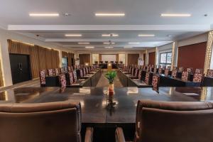 a large conference room with a long table and chairs at Bakadaji Hotel in Serekunda