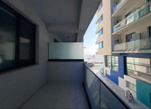a hallway of a building with a view of the ocean at Apartament Poseidon in Mamaia Sat/Năvodari