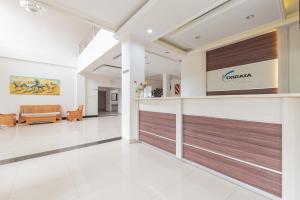 a lobby of a hospital with a wooden door at Urbanview Hotel Tridaya Cisarua Puncak in Kopo 2