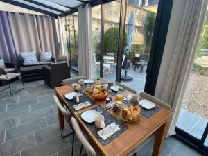 a table with food on it on a patio at Les Rives du Cher - Chambres d'hôtes in Montrichard