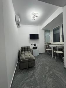 a living room with a couch and a table at Frăția Corsarilor in Sulina