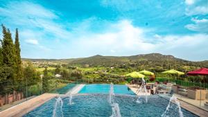 a swimming pool with a fountain in the middle at Dar Zayane in Khenifra
