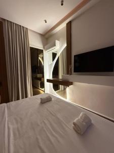 a bedroom with a bed with two towels on it at Penthouse Meknes in Meknès +18 photos