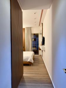 a hotel room with a bed and a television at Penthouse Meknes in Meknès