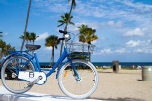 a bicycle is parked on the beach near the ocean at B Ocean Resort in Fort Lauderdale