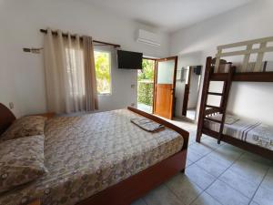 a bedroom with a bed and a bunk bed at Rezidenca Nanaj in Vlorë