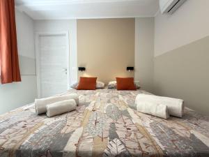 a large bedroom with a large bed with two pillows at Cozy House in Corte in Vimodrone +15 photos