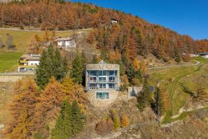an aerial view of a house on a hill at Turm Chalet in Laces