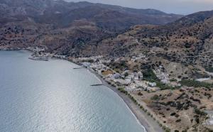 an aerial view of a town next to the ocean at Triton Sea View Studios in Tsoutsouros