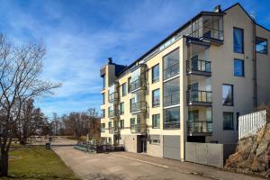 an apartment building with balconies on the side of it at Panorama Suite in Hanko in Hanko