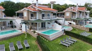 an aerial view of a house with a swimming pool at Xalonia Villas in Agios Nikolaos