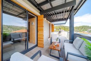 a balcony with a couch and a table at Villa Plitvina in Vela Luka