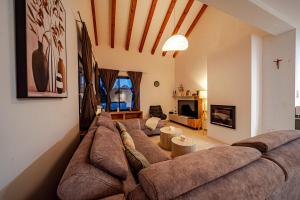 a living room with a large couch in a room at Villa Plitvina in Vela Luka