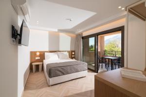 Llit o llits en una habitació de Idi Hotel 176 fotos més