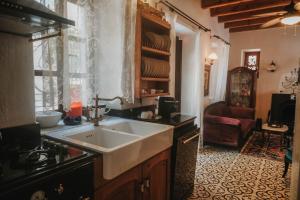 a kitchen with a sink and a counter top at Boleka Bodrum in Bodrum City +62 photos