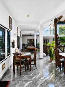 a dining room with a table and chairs at Sigiri Lion Lodge in Sigiriya