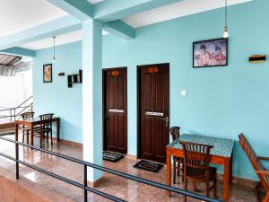a dining room with a table and some chairs at Sigiri Lion Lodge in Sigiriya