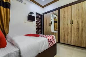 a bedroom with a bed and a tv in it at Hotel Amrapali UDAIPUR BEST GORUP BOOKING HOTEL NEAR CA CIRCLE in Udaipur +4 photos