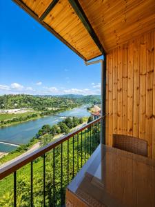 a balcony with a view of a river at Aurora Suit Bungalov in Rize