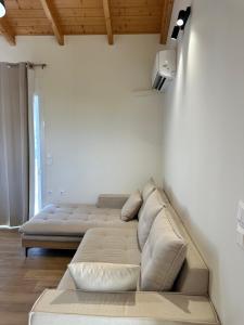 a living room with a couch in a room at Nōema Residences I in Nafpaktos