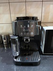 a coffee maker sitting on top of a counter at Biała Centrum in Biała Podlaska