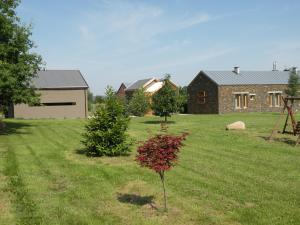 a small tree in the yard of a house at Gospodarstwo Agroturystyczne-Pensjonat SAD in Podgórzyn +28 photos