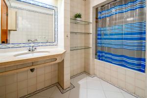a bathroom with a sink and a shower at Bellavista Avenida By BeGuest in Albufeira