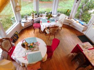 an overhead view of a dining room with a table and chairs at Cliff Crest Inn in Santa Cruz