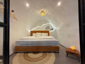 a bedroom with a bed in a room with an arched ceiling at Cocoon De Coron in Coron +52 photos