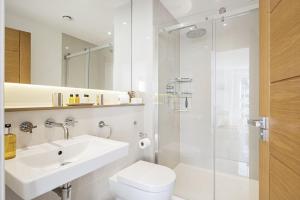 a bathroom with a sink and a toilet and a shower at 8 Salt in St Ives +41 photos