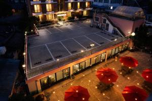 an overhead view of a tennis court on a building with umbrellas at Donhae Dream Beach in Donghae